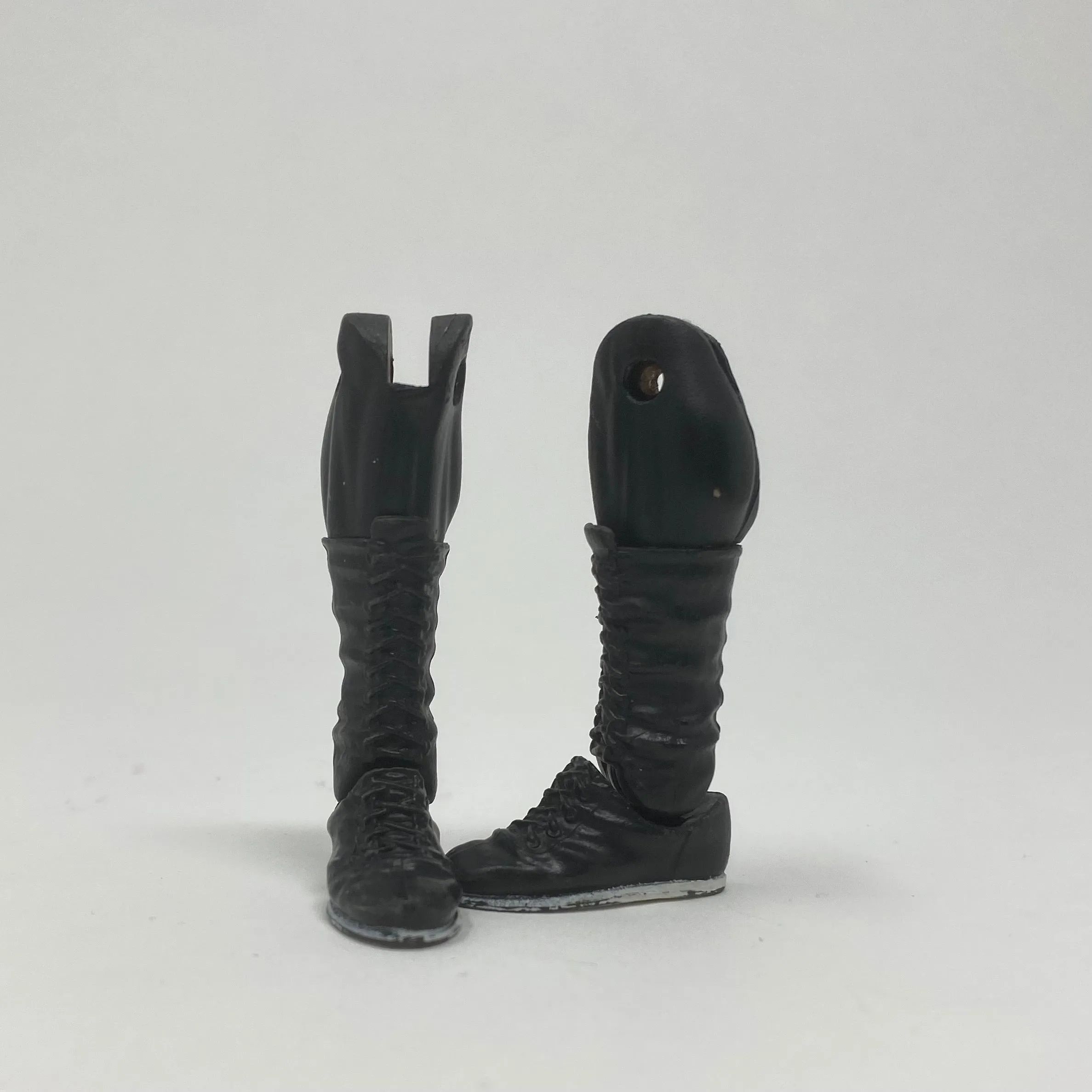 Black laced boots with white soles